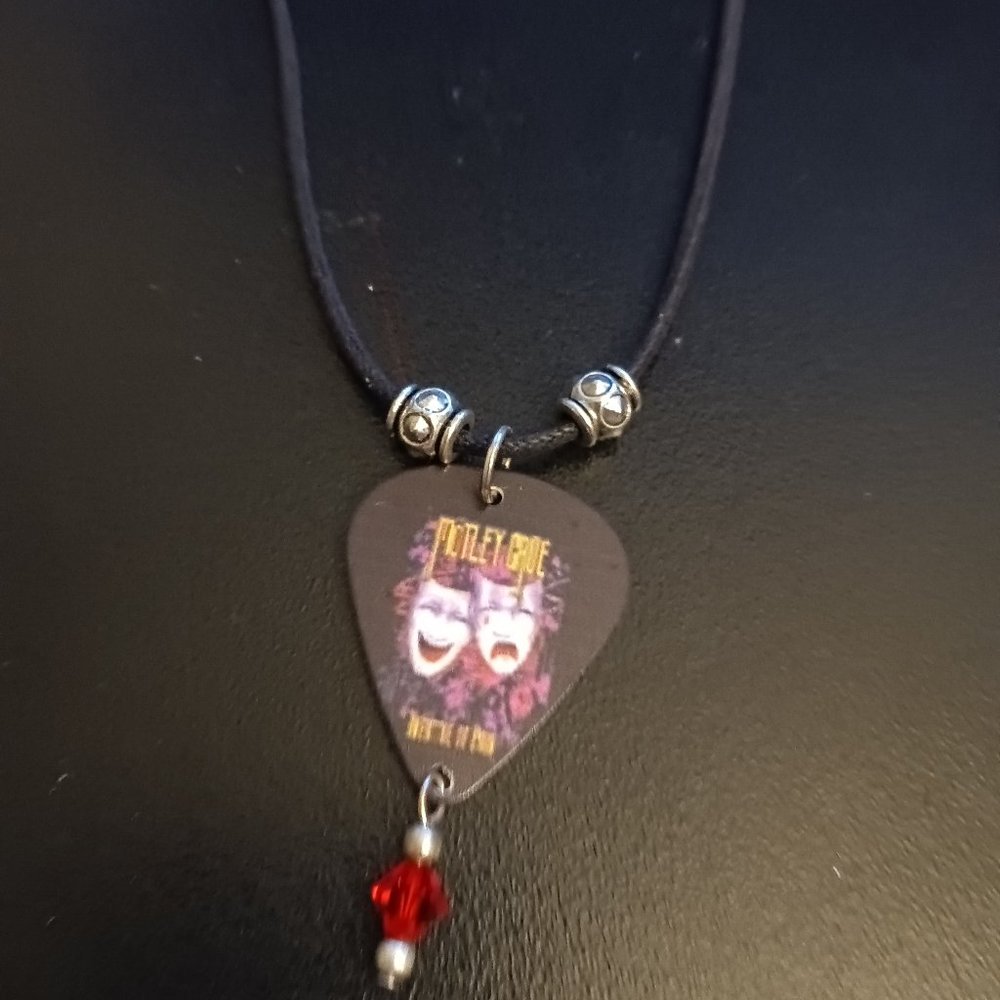 MOTLEY CRUE THEATER OF PAIN GUITAR PICK NECKLACE